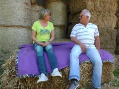 Mature lusty grey haired village slut wanks and sucks dick on straw in shed