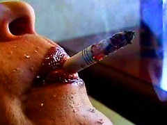 Brunette milf smokes nude