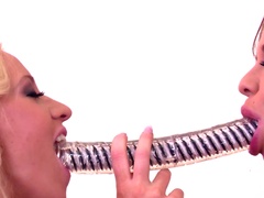 Needy lesbos enjoying the same toy together