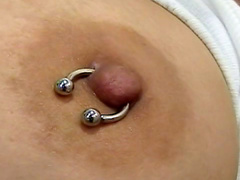 Dark-haired mature with piercing is fucking her puss