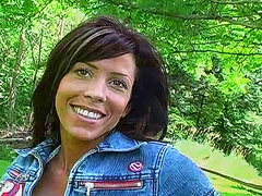 Babe in a bikini teases outdoors