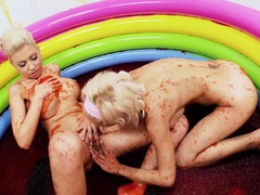 Dirty lezzie oral fun in a pool filled with jam