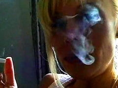 Smoking blonde likes posing nude