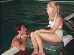 Petite blonde sweetie in the pool is already naked